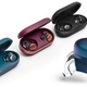 The Ultimate Ears UE Drops wireless earbuds lined up in their charging cases.